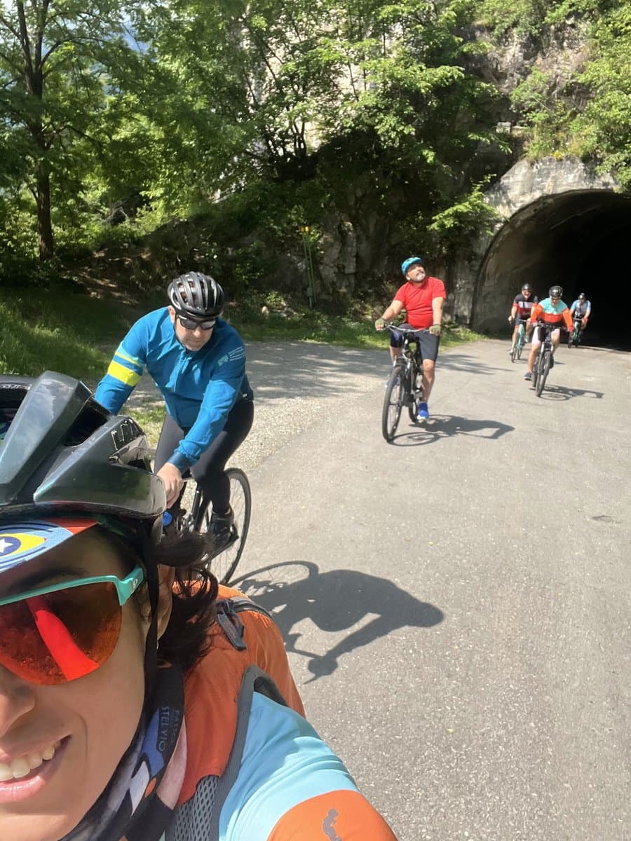 Group of Cyclists Near Tunnel