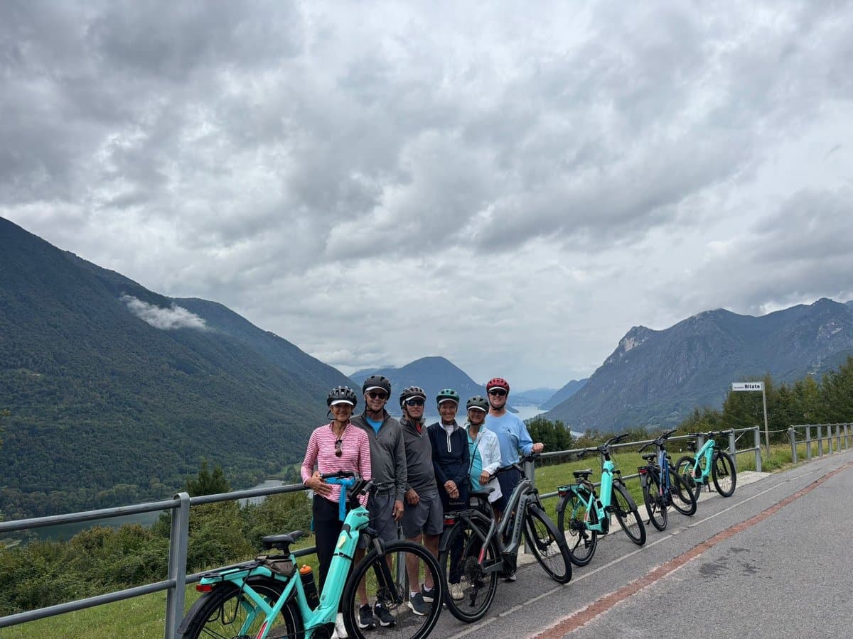 Cyclists with Bikes in Mountain Landscape Cyclists with Bikes in Mountain Landscape