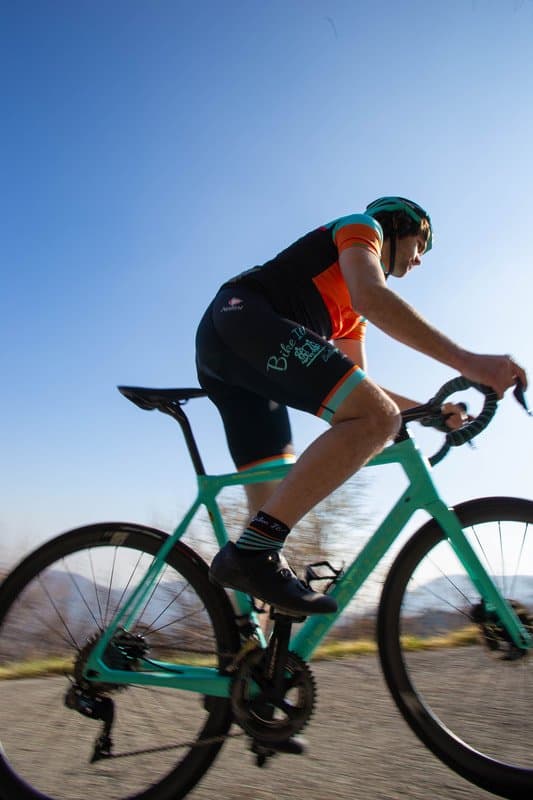 Cyclist on lake como road Cyclist on lake como road