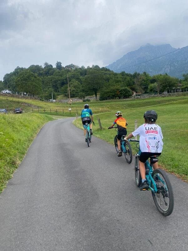 Children Biking on a Scenic Road Children Biking on a Scenic Road